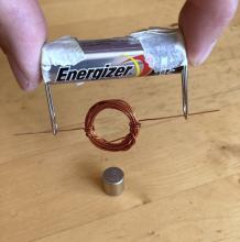 hang the coil from a battery and hold near a magnet