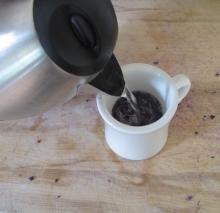 Pour hot water over the red cabbage pieces (use larger pitcher for class)